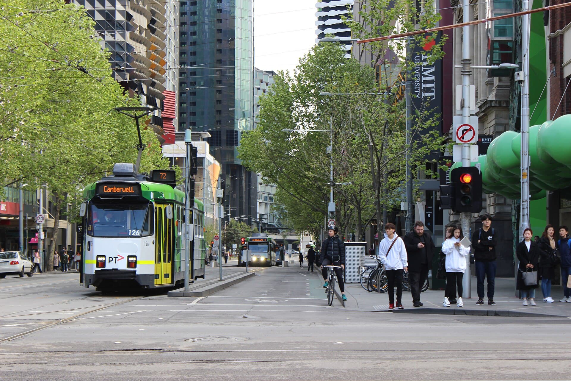 People, tram and bike on Swanston Street, Melbourne (49537527207)
